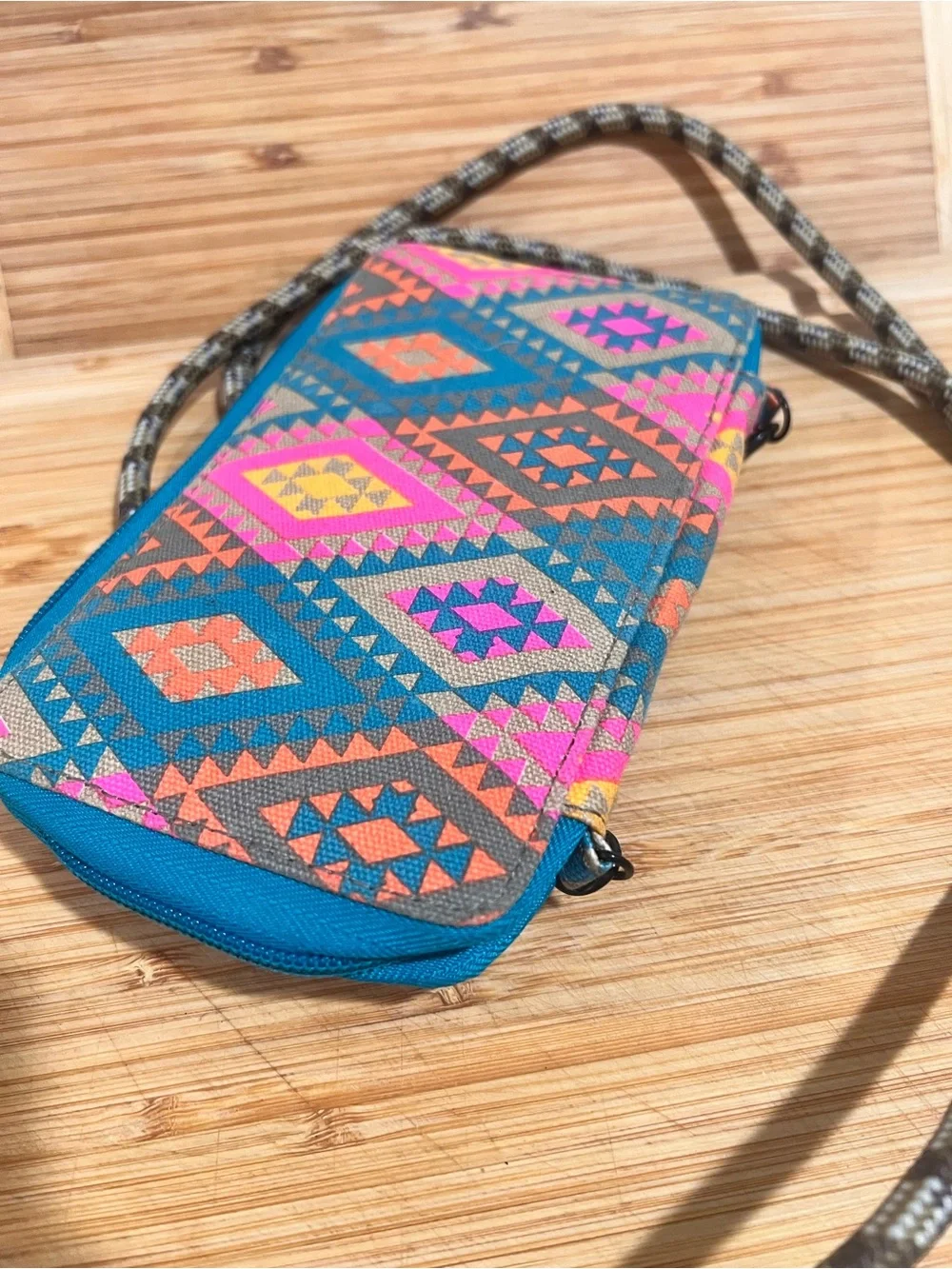 KAVU Go Time Bi-Fold Crossbody Wallet in a colorful geometric print